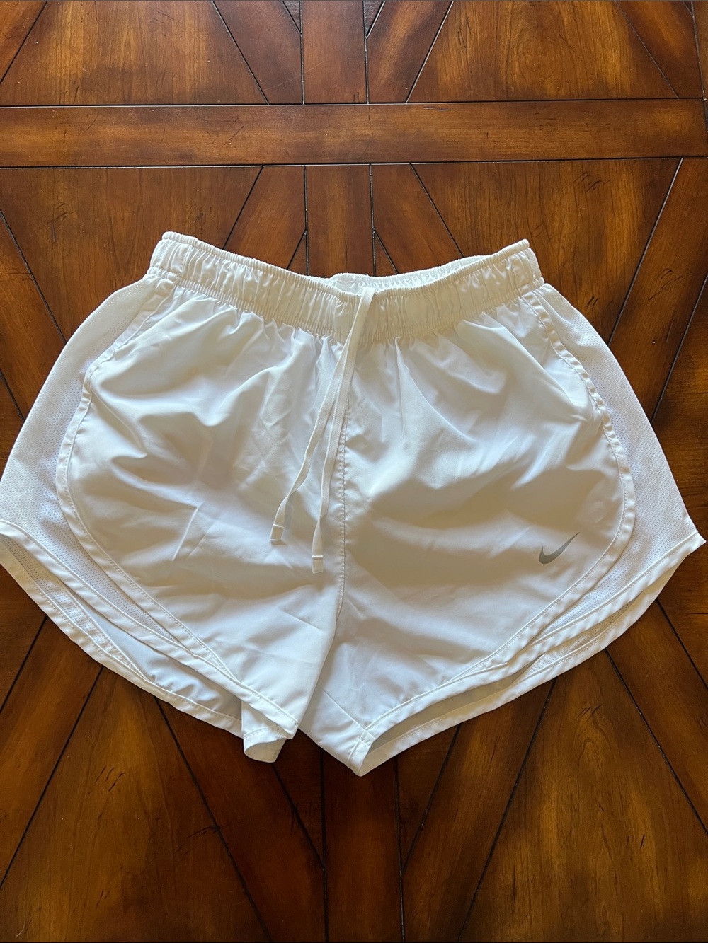 Nike Women's White Athletic Shorts with Silver Swoosh
